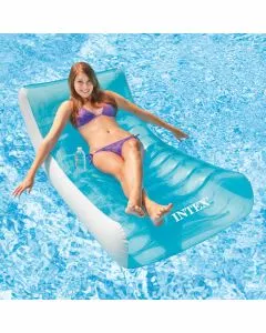 Intex Rockin' Lounge - A smiling woman in a purple bikini reclines on a translucent blue and white inflatable pool float, holding a water bottle, in a swimming pool. The "INTEX" logo is visible on the float.