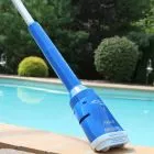 Aqua Broom Handheld Pool Vacuum lifestyle view at ledge of pool