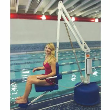 Individual using the Aqua Creek Revolution pool lift to enter a spa, highlighting ADA compliance.