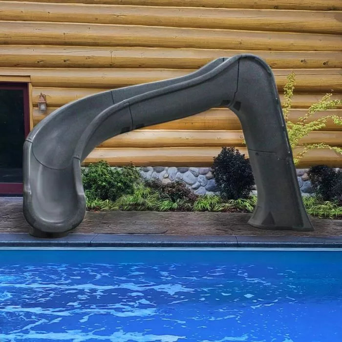 SideWinder Pool Slide on inground pool decking SideWinder Pool Slide on inground pool decking